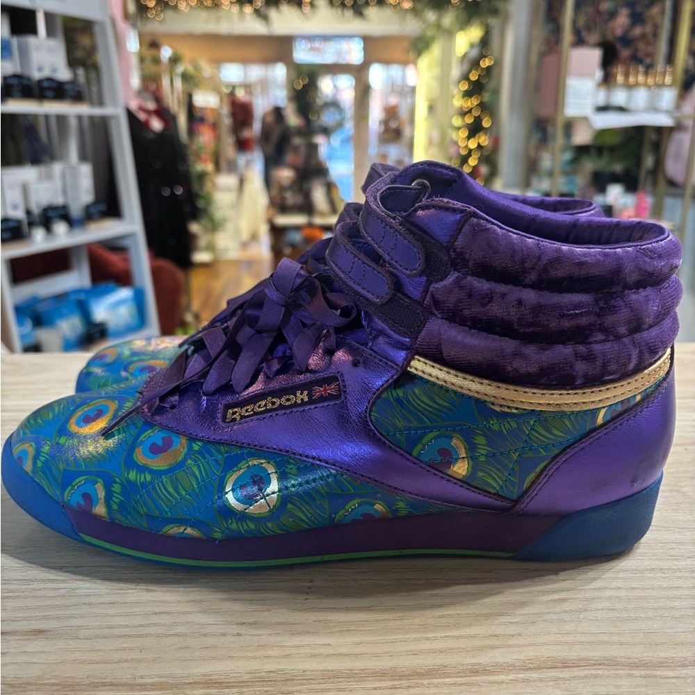 Reebok Women's Freestyle Hi top in Purple and Green Peacock pattern Sneakers